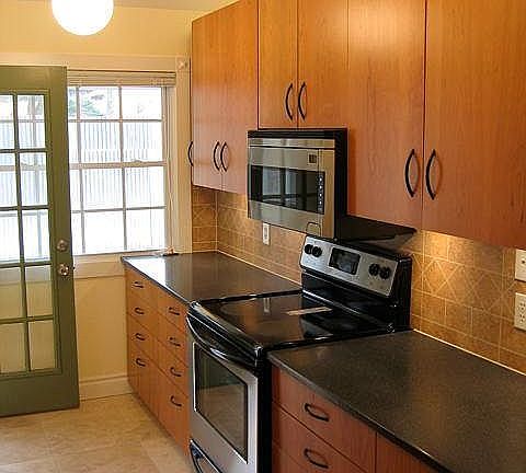 Separate door leads to patio. Ample storage and counter spac