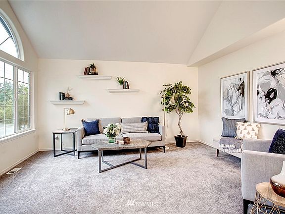 Sunny living room enjoys south facing  pretty palladium window !