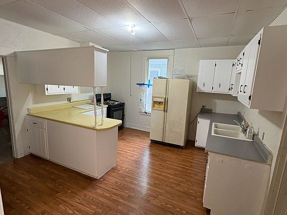 New laminate and freshly painted cabinets and hardware.