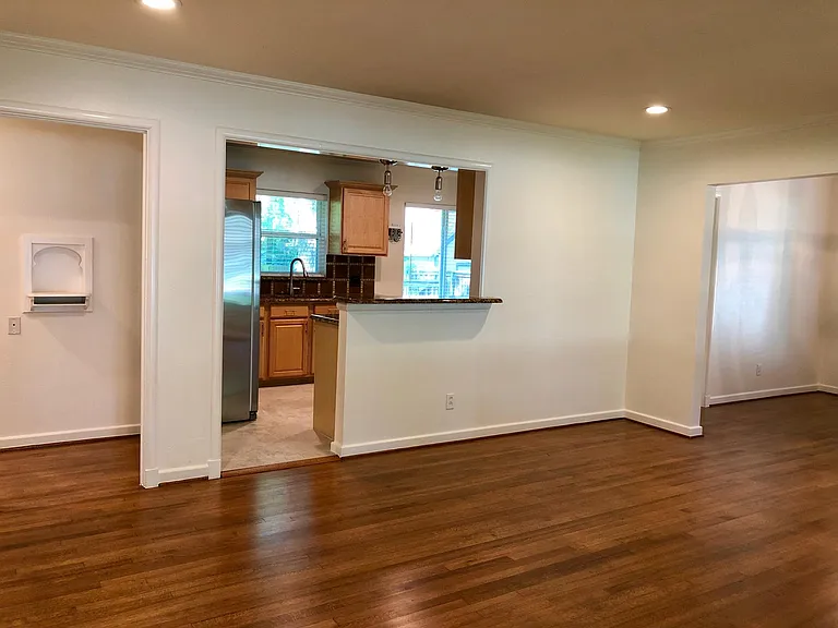 Open concept living room with access to dining room