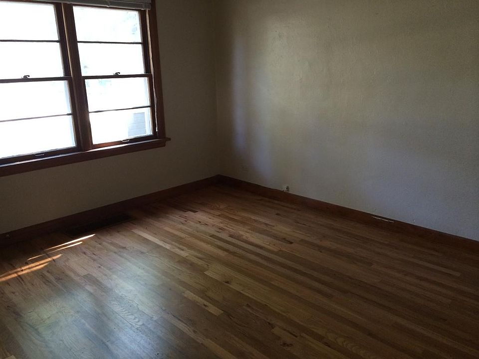 Main floor bedroom with hardwoods, south and western light through 2 sets of windows.