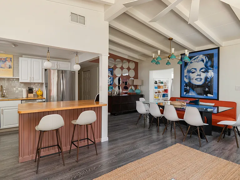 View of dining room and kitchen island from living room.