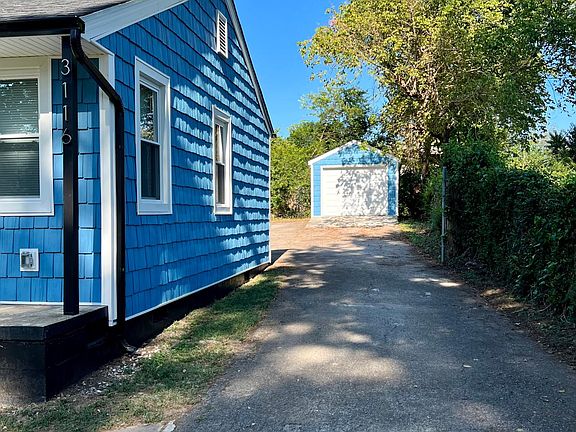 Driveway with detached 1-car garage