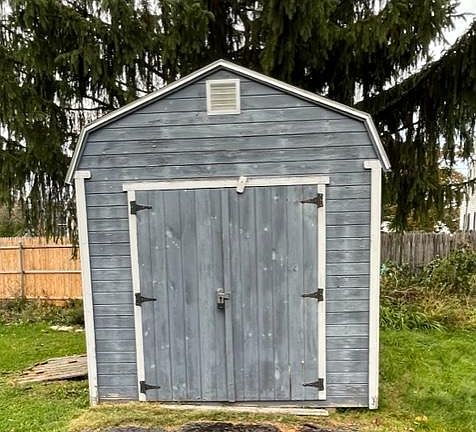 Secure storage shed for yard items, outside toys, bikes, recycling & trash bins