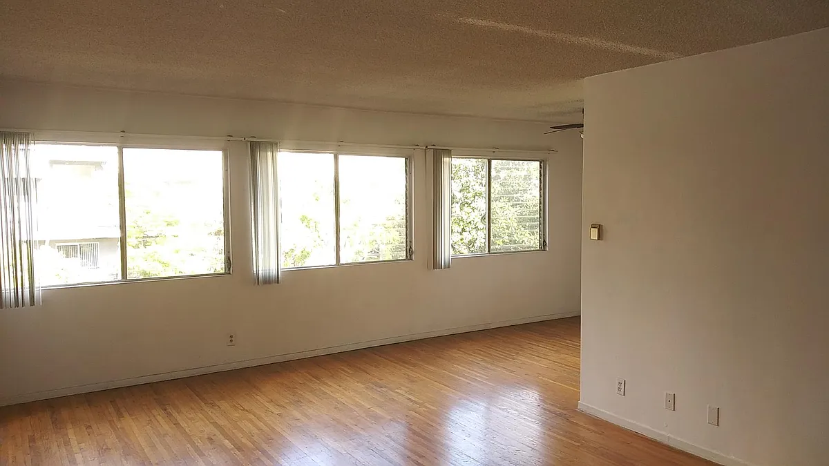 Living Room, lots of windows - 7920 Selma Ave #11