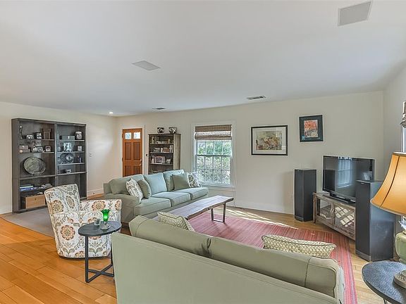 Enter this adorable bungalow with hardwoods and an abundance of natural light