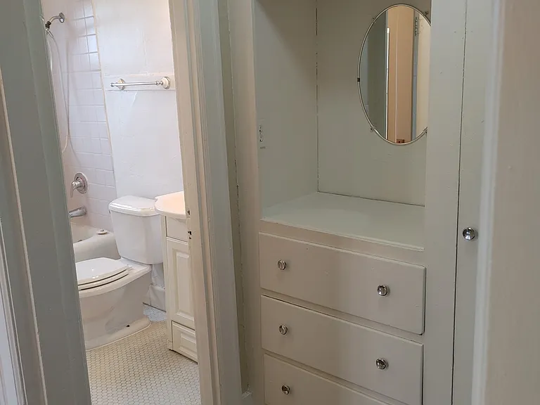 Spacious walk in closet with restored built ins!