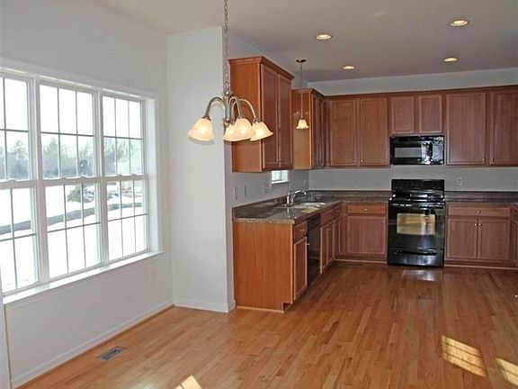 Sunny eat-in kitchen with great view of backyard
