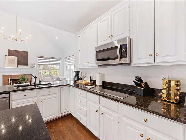 Refinished cabinets with stainless steel appliances
