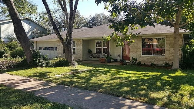 Front of house with picture taken in the fall. Note the tree on right corner facing house.