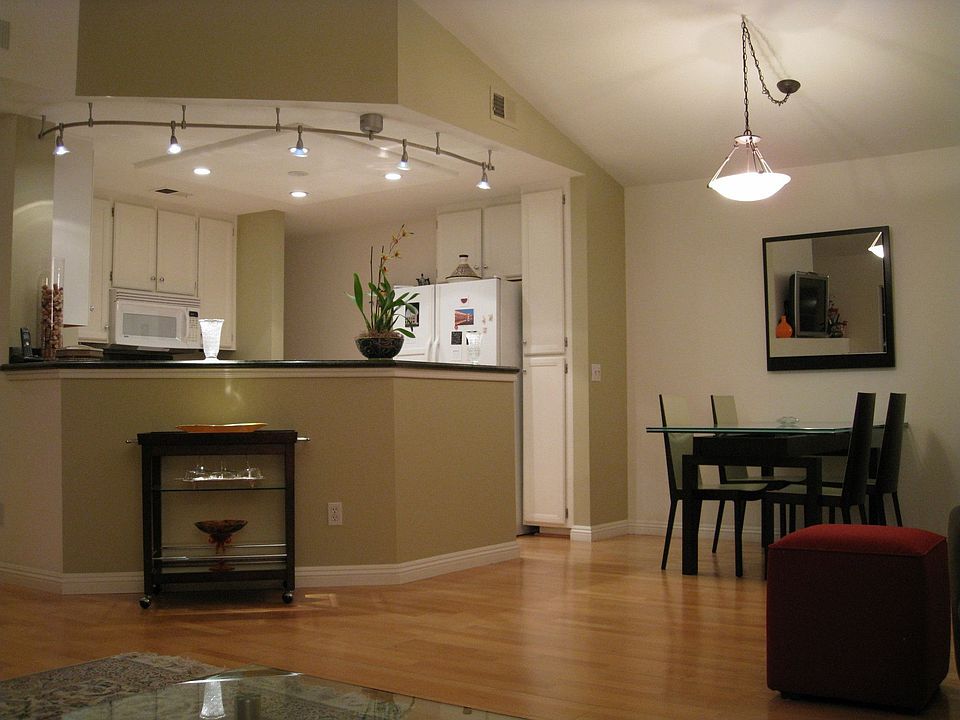 Dining room and kitchen with high vaulted ceilings