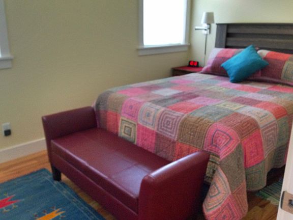 Main bedroom with queen bed; high-end linens