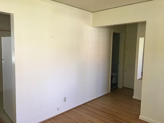 living room looking toward bathroom on left