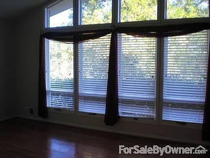 LIVING ROOM : LARGE LIVING ROOM WITH CUSTOM BLINDS AT THE WINDOWS