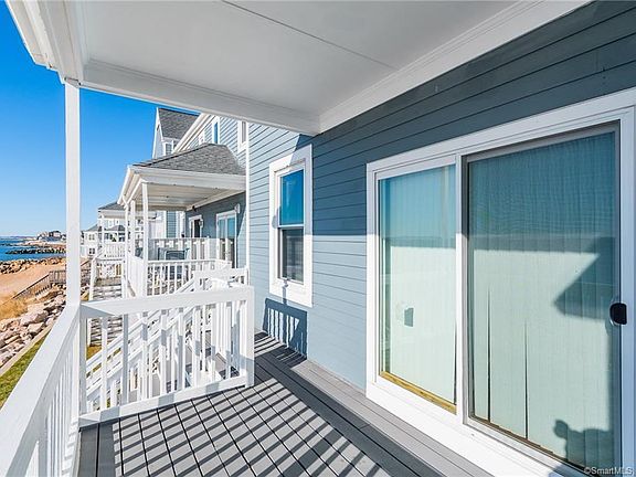 Deck off living room, stairs to beach access