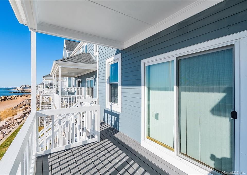 Deck off living room, stairs to beach access