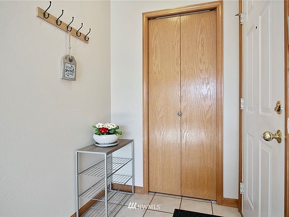 Coat closet  with nice sized entry space.