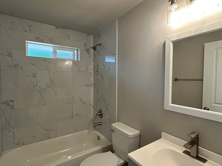 Updated full bathroom with tub. Bright light fixtures!