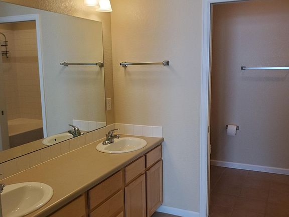 Master bath with separate room for tub shower & toilet.