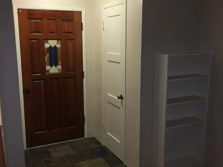 large entryway closet and built in shelving