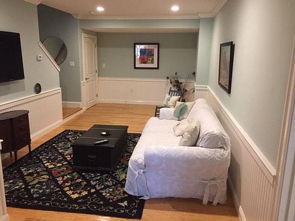 living room with 50 inch smart tv brand new wall mounted inc