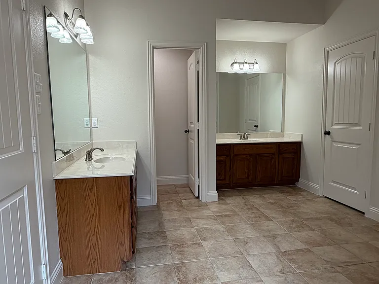 Master bath - double vanities and private toilet room