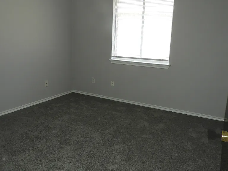 Bedroom #3 with ceiling fan and walk-in closet.