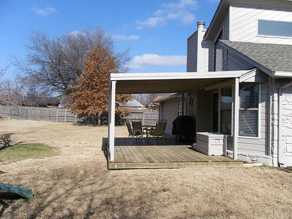 Large backyard with covered deck.  Great for entertaining.