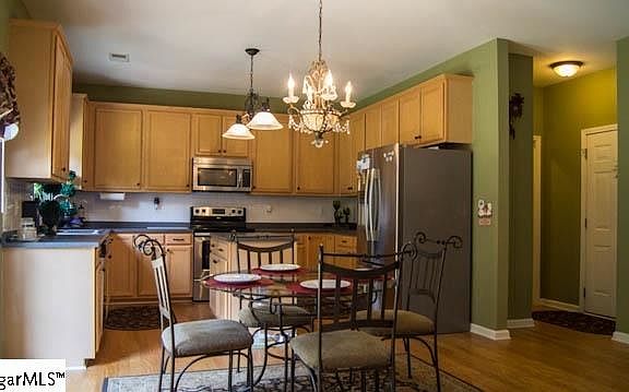 Large open kitchen with direct access to back porch. Perfect layout for grilling and entertaining.