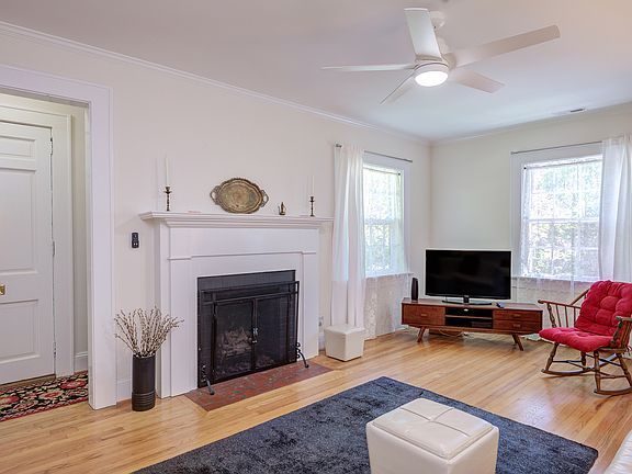 Living room with gas logs fireplace, smart TV