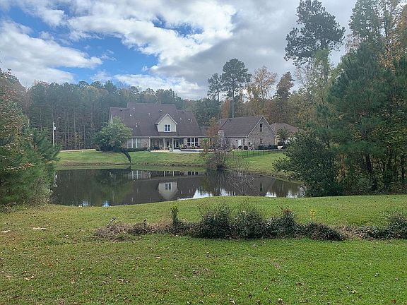 Back of House view with pond