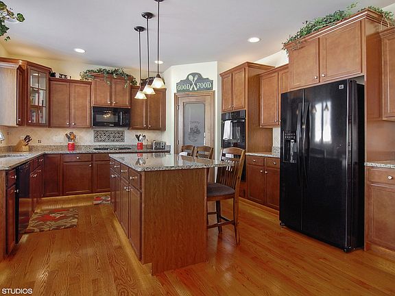 Well appointed kitchen~note the walk-in pantry, toe kick lighting and under cabinet lights.