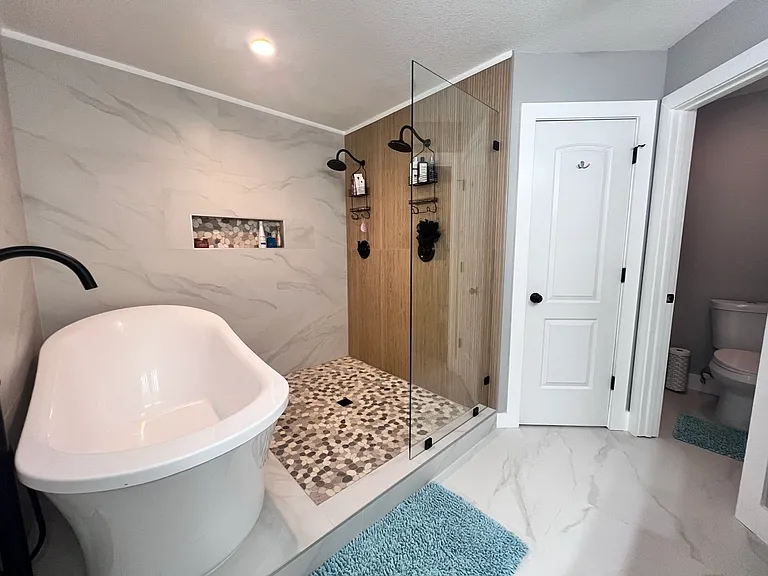 Dual showers and soaking tub in primary bath