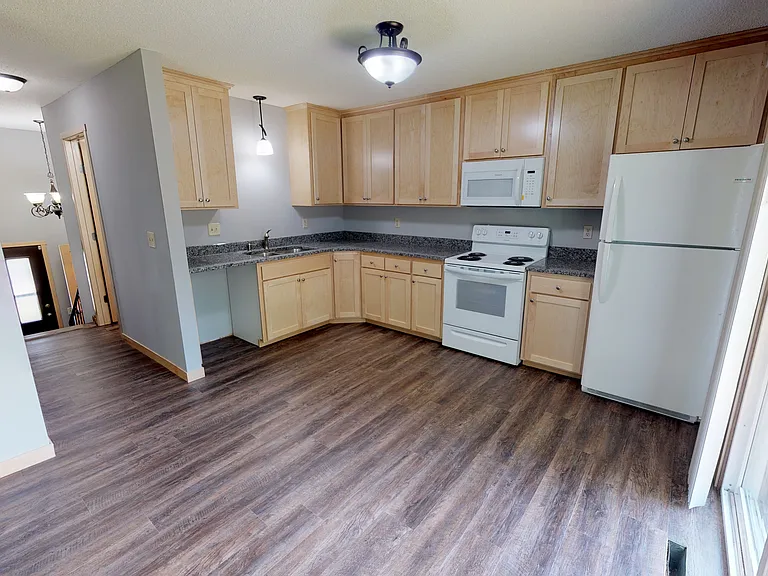 Kitchen featuring updated flooring and countertops