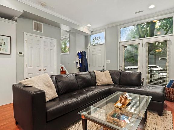 Main living area with gas fireplace. First floor with picture windows and lots of natural light.