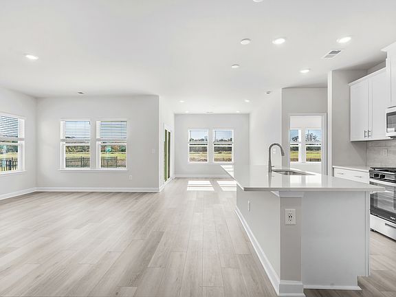 The kitchen overlooks the dining area and great room.