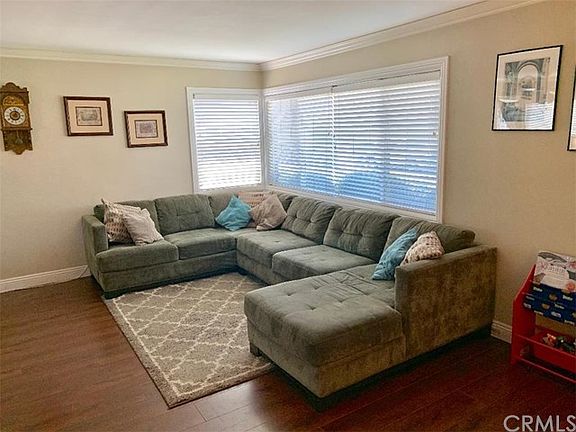 View of the Living Room from the Front Door.  Notice the nice crown molding and baseboards