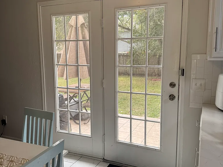Double french doors to backyard