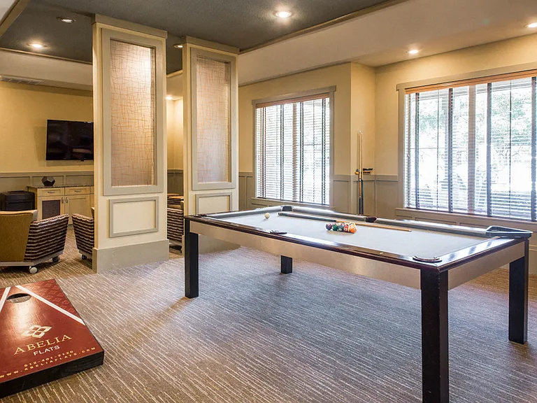 Game Lounge with pool table and corn-hole