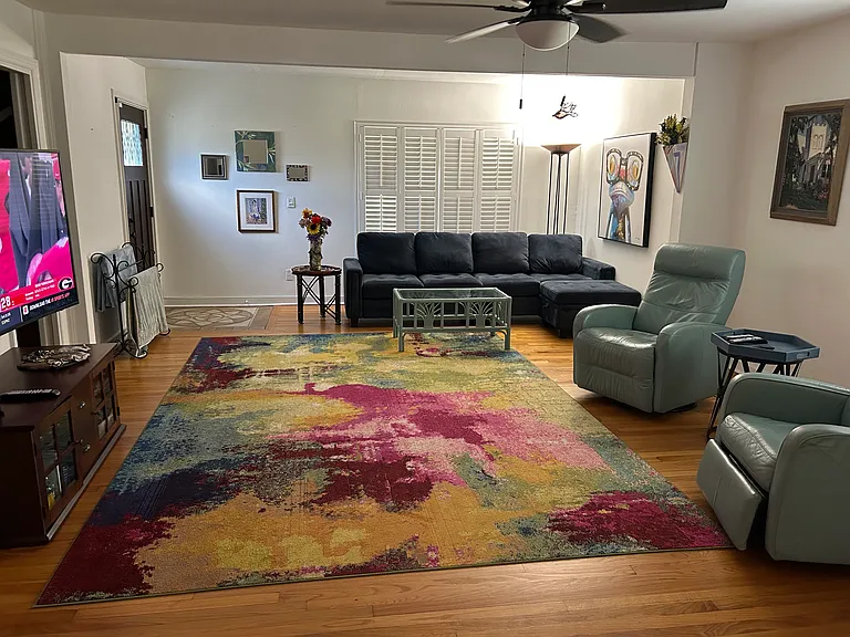 spacious living room with sectional and 2 automatic leather recliners