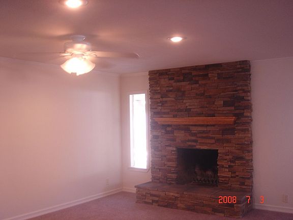 living room with ceiling fan