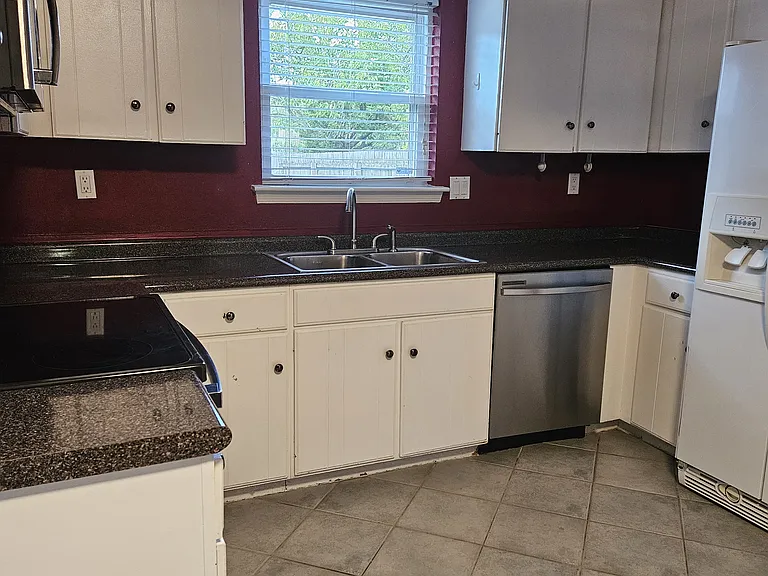 Kitchen with stainless steel range & dishwasher