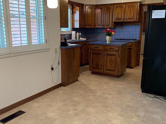 Kitchen and informal dining area as viewed from front entry.