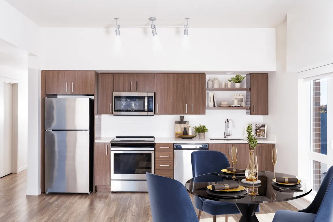 A bright, streamlined kitchen at Modera Belmont, offering modern finishes and an easy flow just steps from Belmont's shops, dining, and neighborhood staples.