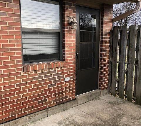 Rear Patio with New Door & Storm Door