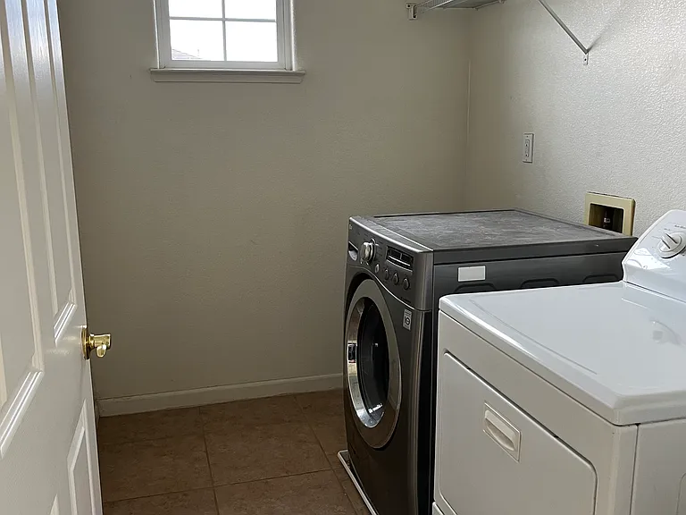Large, second floor laundry room with extra space