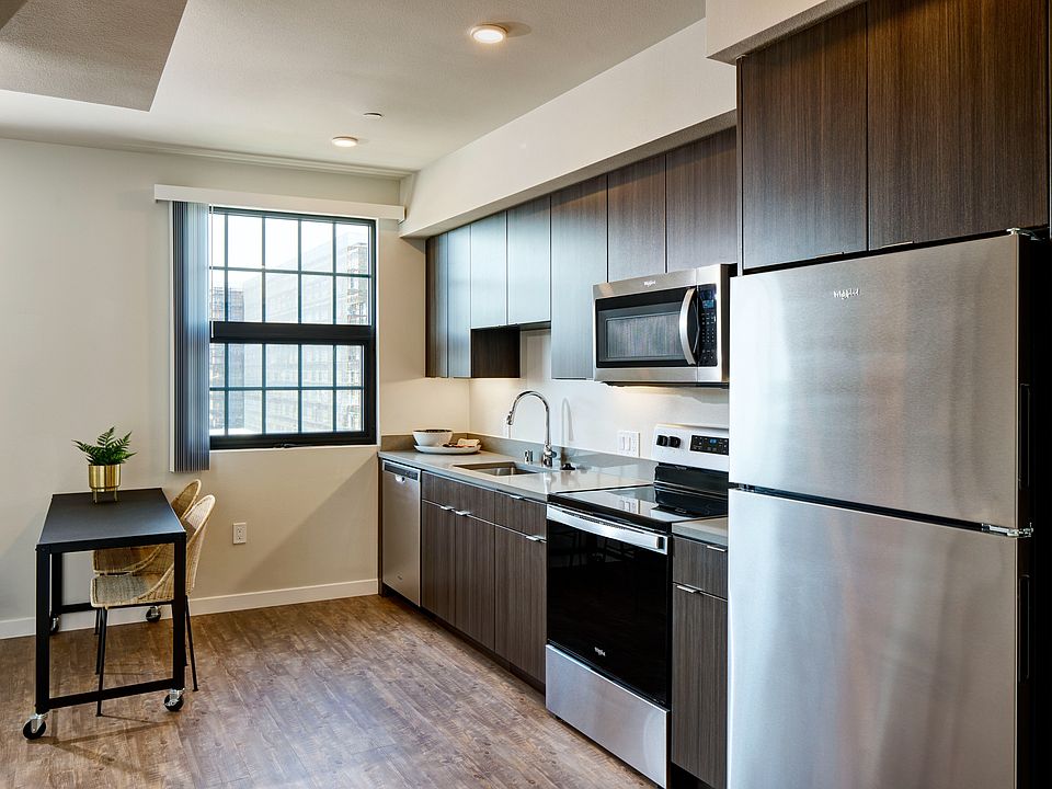 Modern kitchens featuring dark cabinets and chrome pulls