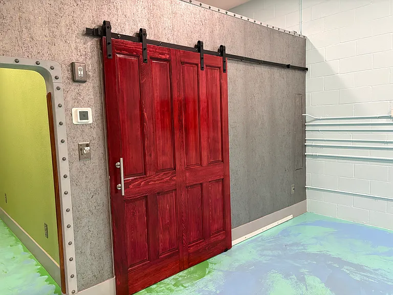Entrance to second bedroom with double barn doors.