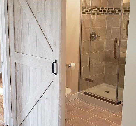 Barn door into bathroom