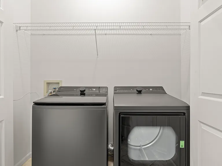 Dedicated laundry area on the main level with new smart washer and dryer for easy, convenient laundry care.